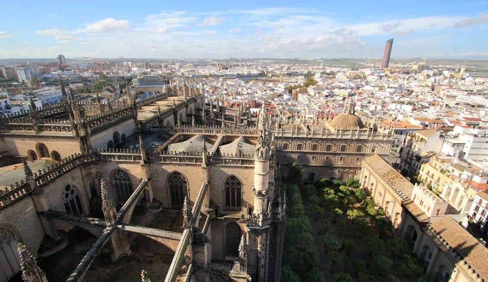 Aerial view of Seville Cathedral's rooftop, the Courtyard and the cityscape